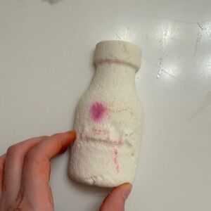 Lush Milk Bottle-Shaped Bath Bomb with Pink Accent